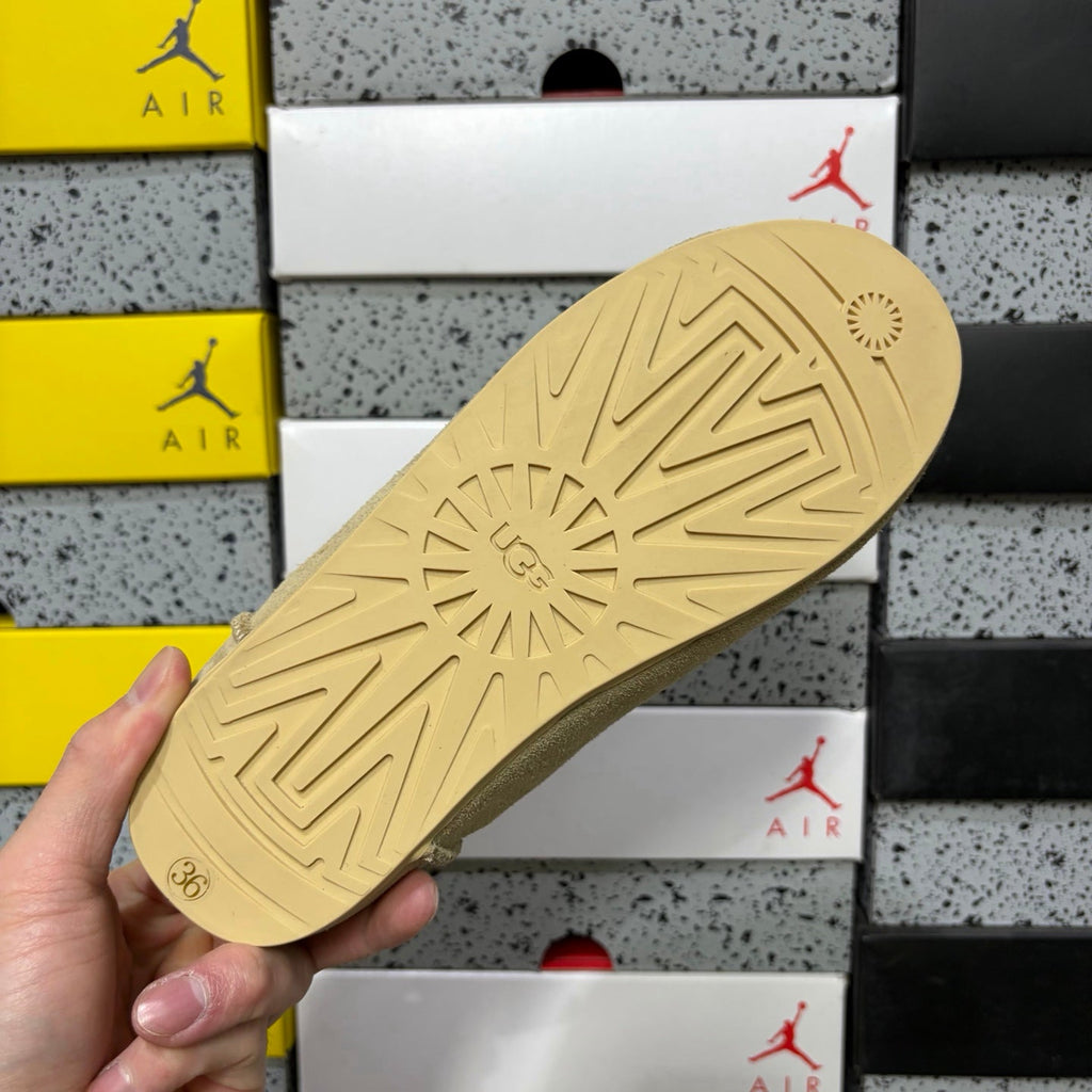 UGG Suede Mule – Women’s Backless Clog with Gold Rivet Accents & Shearling Lining in Sand